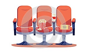 Red chairs, popcorn and soda for watching a movie.