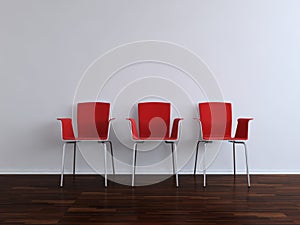 Red Chairs to face a blank wall