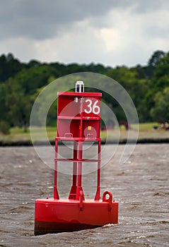 A red channel marker buoy.