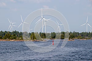 Red channel marker and wind turbines on the small craft route on Georgian Bay