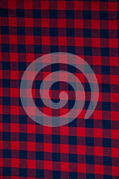 Red checkered fabric texture, background with copy space