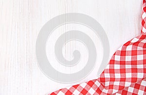 Red picnic checkered cloth on white wooden background empty copy space,food advertisement frame design