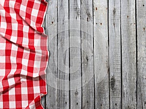 Red checkered tablecloth on wooden table