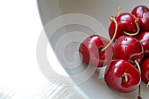 Red cheery in white dish