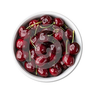 Red cherries on a bowl isolated over white background