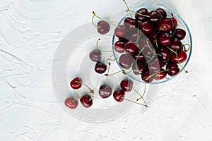 red cherries in a bowl top view