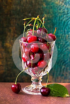 red cherries in a glass jar, on a wooden table, country atmosphere, ia generated