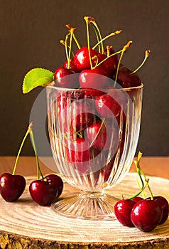 red cherries in a glass jar, on a wooden table, country atmosphere, ia generated