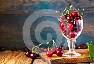 red cherries in a glass jar, on a wooden table, country atmosphere, ia generated