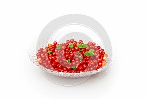 Red cherries harvested in autumn on a glass plate