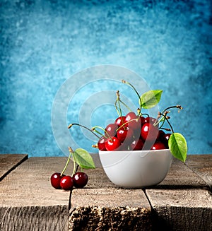 Red cherries in plate