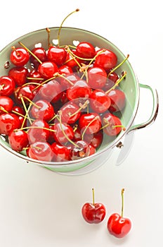 Red cherries in a vintage bowl