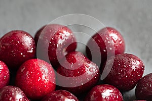 Red cherries in water drops close-up. Cherry berry background. Berry pattern and texture. Food background. Fresh ripe