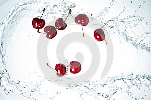 Red cherries water splash