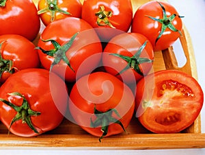 Red cherry tomatoes fruit vine tomato vegetable 
tamaatar tomat timatar pomidor tomate closeup view image photo