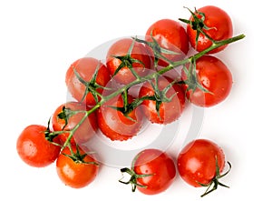 Red cherry tomatoes on a white. The view from the top.