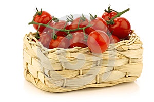 Red cherry tomatoes in a woven basket