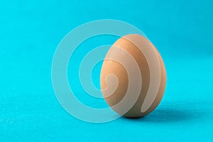 Red, chicken egg on a blue background