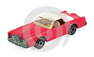 Red children's toy car model with white roof