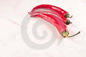 red Chile on white marble background/red Chile on white marble background. Copy space