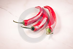 red Chile on white marble table/red Chile on white marble background. selective focus