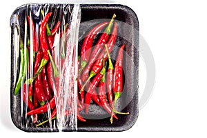 Red chili in foam and plastic package