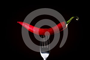 Red chili on a fork