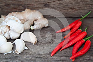 Red chili, garlic and ginger on wooden table, Spicy and herb, Food ingredient