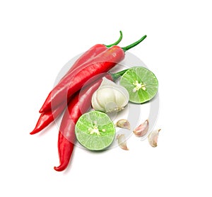 Red chili , garlic and lime lemon arrange on white background