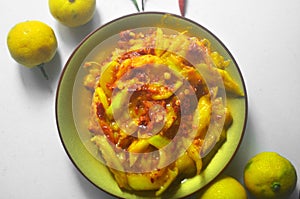 Red chili mixture with slice manggo fruit to make manggo sambal or paste