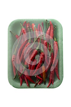Red chili paprika wrapped in green tray
