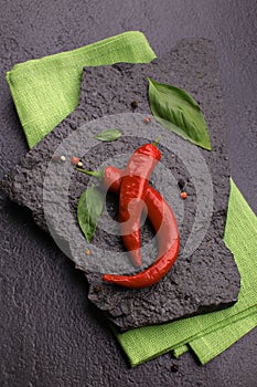 red chili pepper on black slate photo