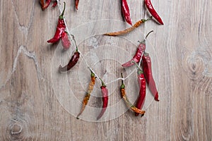 Red chili pepper. Dry hot peppers on a wooden background. Bunch of dry red chili peppers. Spice