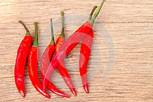 Red chili pepper on old wood background