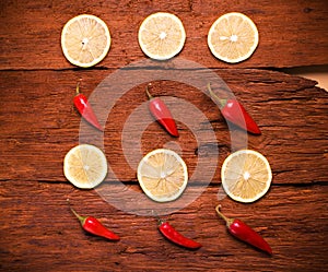 Red chili pepper, slices a lemon