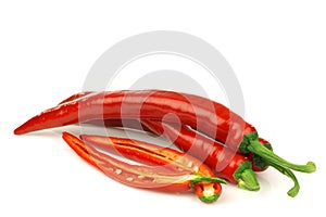 Red chili peppers (Capsicum) and a cut one