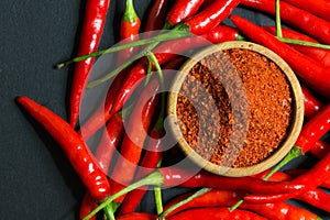 Red chili peppers and chili flakes photo