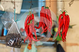 Red Chili Peppers hanging outdoor in the market
