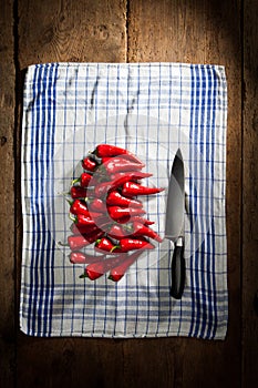 Red chili peppers with knife