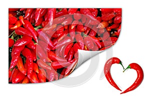 Red chili peppers with two peppers forming a heart