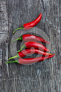 Red chili peppers on a wooden table