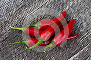 Red chili peppers on a wooden table