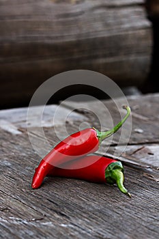 Red chili peppers on a wooden table