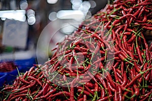 Red chilli is not cool, piled up for sale in Amorn Nakhon Naklua Fresh Food Market photo