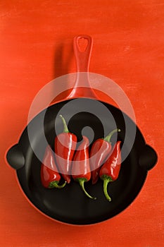 Red Chilli Peppers In A Frying Pan