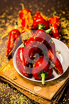 Red chilli pickle marinated in mustard seeds and mustard oil. Dark gothic style still life concept photo