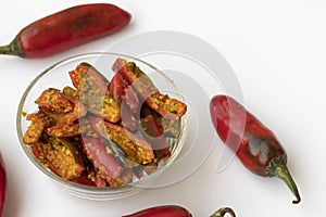 Red chilli pickle in transparent glass bowl photo