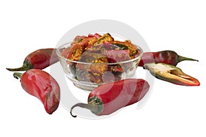 Red chilli pickle in transparent glass bowl photo