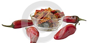 Red chilli pickle in transparent glass bowl photo