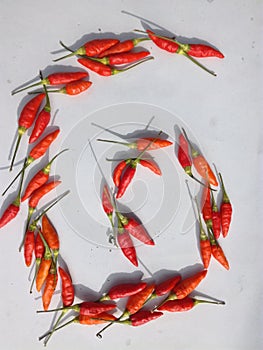 Red chillies on a white background. Very beautiful.